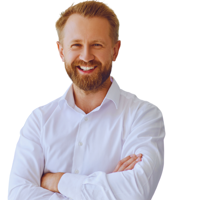 A bearded man with blonde hair, wearing a white dress shirt, stands smiling with his arms crossed against a plain background, embodying the confidence found in success stories. | Humanico Workforce Intelligence Software