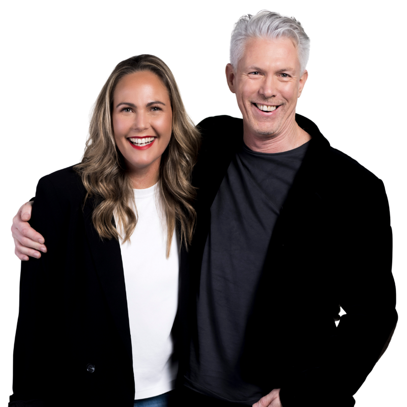 Two people smiling, with one person’s arm around the other. Both are wearing casual clothes and dark jackets, standing close together against a white background—these are the Humanico founders. | Humanico Workforce Intelligence Software