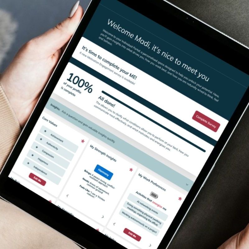 A person holds a tablet displaying an online survey with the message, "Welcome Madi; it's nice to meet you," showing 100% survey completion and insights on core values, strengths, and work preferences—ideal HR tools for new managers. | Humanico Workforce Intelligence Software
